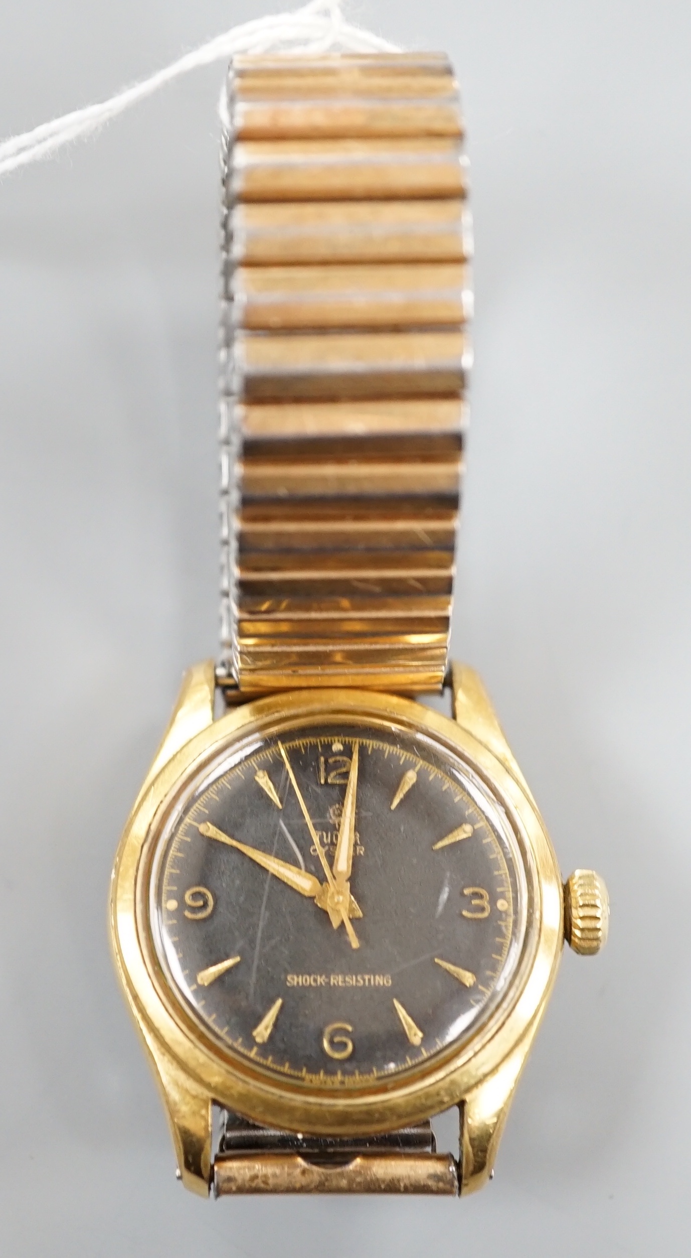 A gentleman's 1950's? mid-size steel and gold plated Tudor Oyster manual wind wrist watch, with black dial and associated strap, case diameter 33mm, no box or papers.